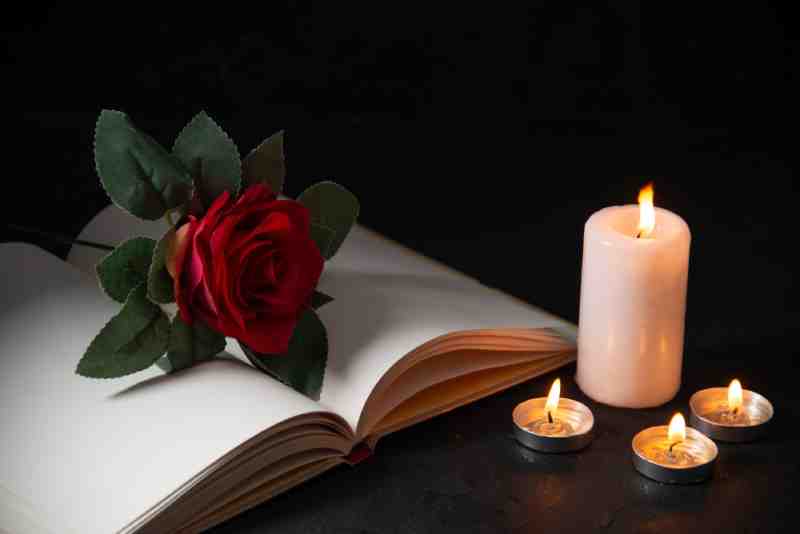 burning-candle-and-rose